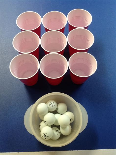 bouncing ping pong balls into the cups just one of the games simply hillarious ping pong