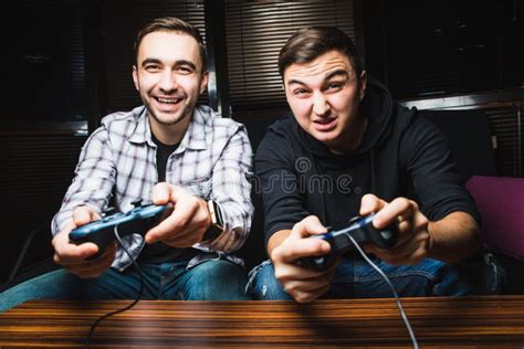 Two Young Happy Men Playing Video Games Stock Photo Image Of