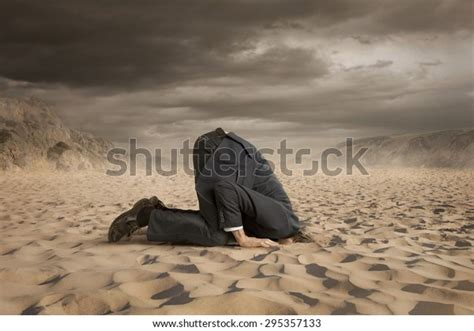 Young Businessman Hiding Head Sand Stock Photo Edit Now 295357133