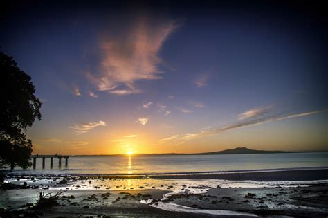 Sunrise On The Beach In Auckland New Zealand Image Free Stock Photo
