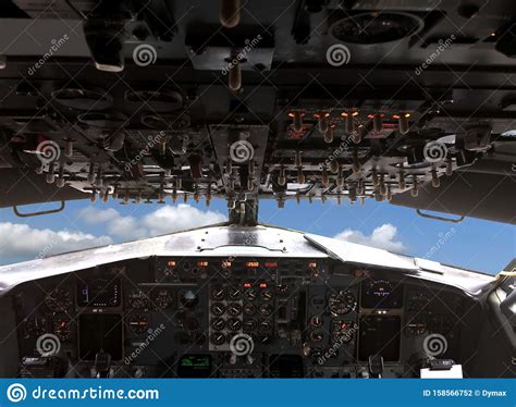 Pllane Is Flying Above White Clouds On Blue Sky View From Pilots Cabin