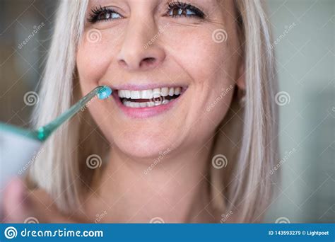 Pretty Middle Aged Woman Brushing Her Teeth Stock Image Image Of Foaming Loss 143593279