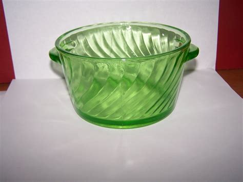 This is called vaseline glass and it has a small amount of uranium in it. Uranium glass handled dish for ID and age? | Antiques Board