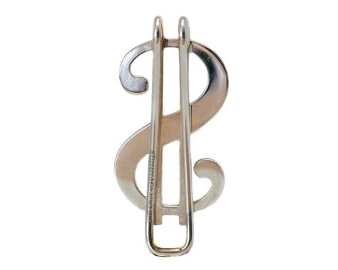 This money clip is a simple yet stylish accessory. Tiffany and Co. Dollar Sign Money Clip at 1stdibs