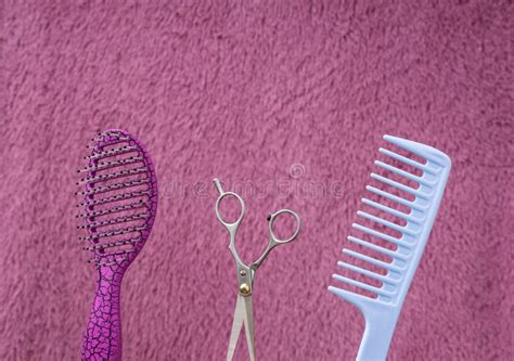 Closeup Of Pink Brushblue Combscissors Against Hairy Backgroundempty
