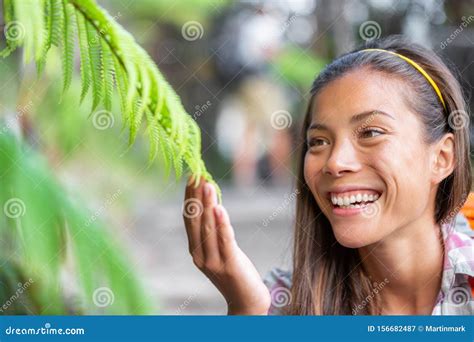 Nature Interpretation Park Guide Woman Touching Plants For Environment