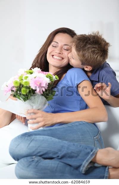 Little Boy Kissing His Mom On Stock Photo Edit Now 62084659