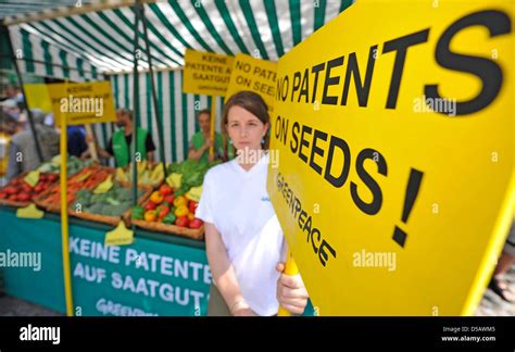 Several Greenpeace Activists Show Signs Saying No Patents On Seeds