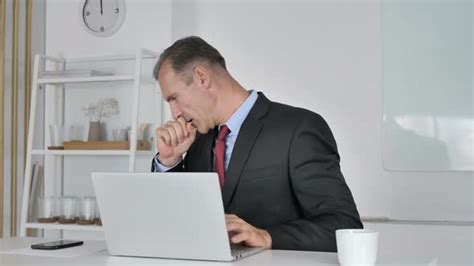 Middle Aged Businessman Coughing At Work Cough And Throat Soar Stock