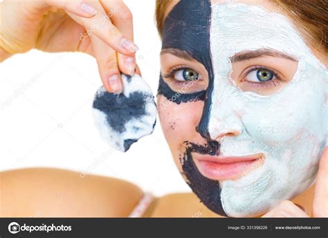 Girl Remove Black White Mud Mask From Face Stock Photo By Voyagerix