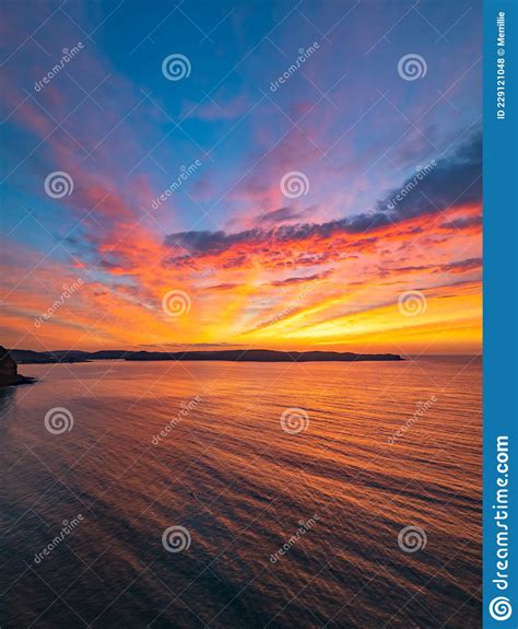 High Cloud Sunrise Seascape With Soft Shades Of Colour Stock Photo