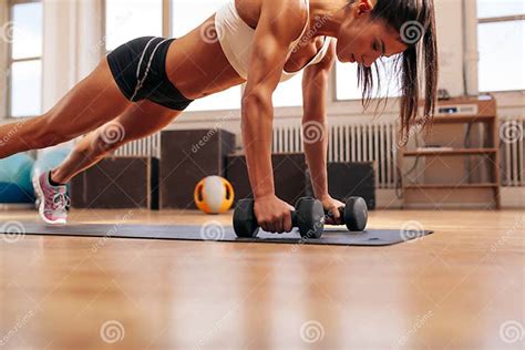 Fitness Woman Doing Push Ups Exercise With Dumbbells Stock Image