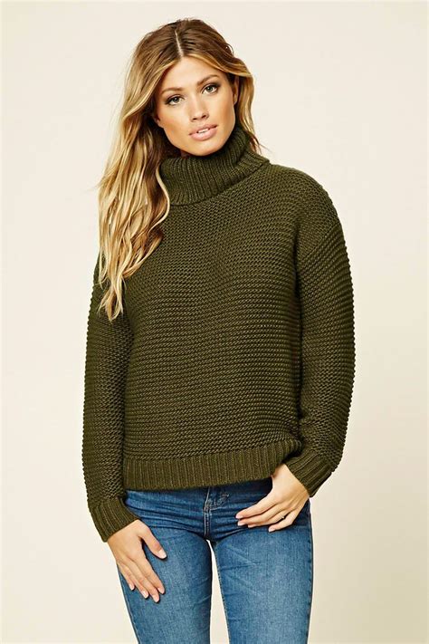 A Waffle Knit Sweater Featuring Long Sleeves A Turtleneck And Ribbed