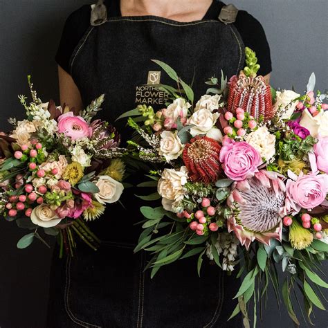 gina and rex s wedding florals were a mix of cream blush and dark pinks and natives and with