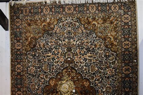 A Large Fine Quality Hand Knotted Silk Rug With Central Rugs