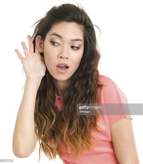 Young Woman Listening With Hand To Ear High Res Stock Photo Getty Images