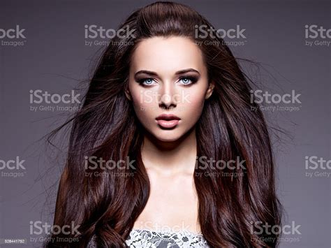 Portrait Of The Beautiful Young Woman With Long Brown Hair Stock Photo