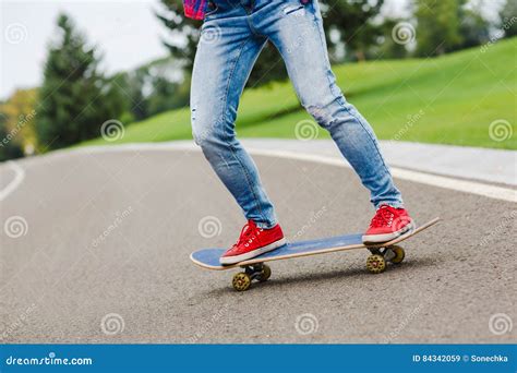 Skateboarder Girl With Skateboard Outdoor Skatebord At City Street