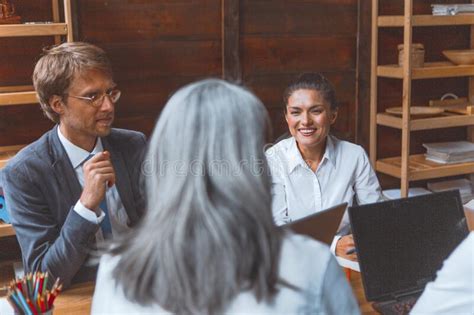 Toned Image Of Supervisor Showing Planning Concept To Team Sitting In