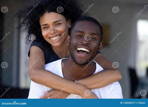 Happy Millennial Black Couple Laughing Having Fun Outdoors Portrait