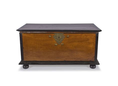 A Batavian teak and ebony brass-mounted chest, 19th century | Strauss & Co