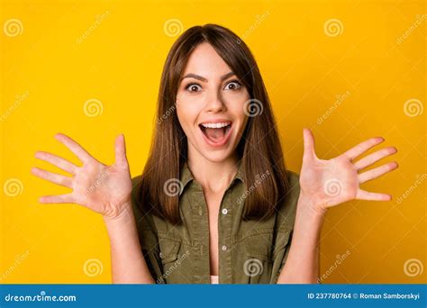 Photo Of Excited Young Lady Raise Palms Shocked Face Open Mouth Wear Green Shirt Isolated Yellow