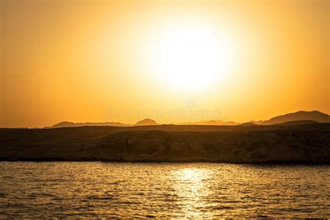 Bright Yellow Sun In The Sky Beautiful Yellow Sunset On Red Sea Stock