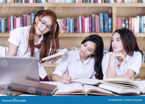 Group Of College Students Studying In The Library Stock Photo Image