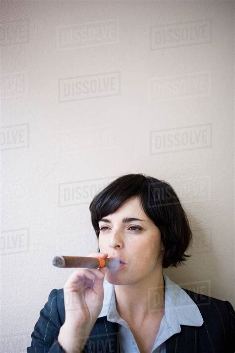 Businesswoman Smoking Cigar Stock Photo Dissolve