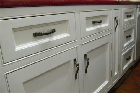 Another vertical kitchen cabinet handle option is this one, which is a modern contrasting decorative element on the white cabinets. Cast Iron Cabinet Draw and Door Handles | Lumley Designs