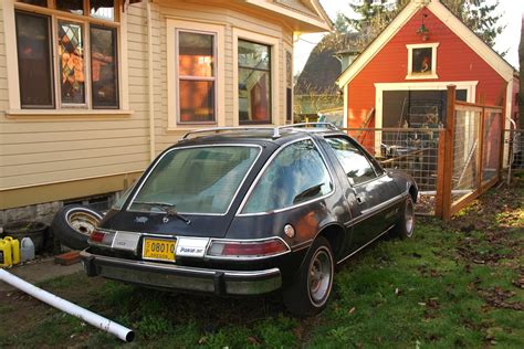 When she gave in to practicality, she didn't give up her individuality. OLD PARKED CARS.: 1977 AMC Pacer X.