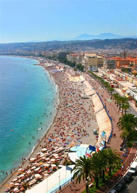 The Crowded Beach Of Nice French Riviera Traveltheworld Pinterest