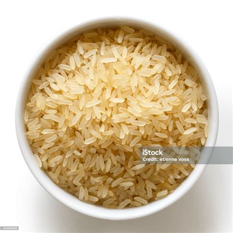 Bowl Of Long Grain Parboiled Rice Isolated On White Stock Photo
