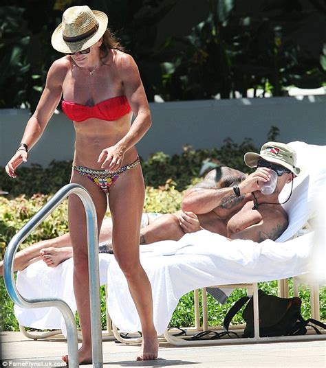 Michelle Bridges And Her Beau Steve The Commando Willis Frolic In The Pool During Romantic