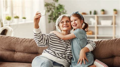 grandmother taking selfie with granddaughter stock image image of copy media 181364111