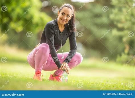 Close Up Portrait Of Smiling Sporty Attractive Young Woman Outdoors