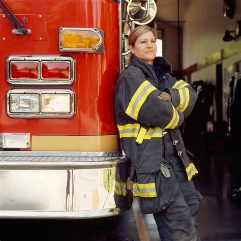 Smiling Female Woman Firefighter Wearing Technical Clothing Bunker Gear