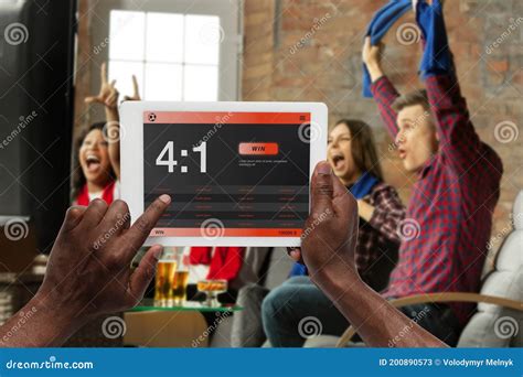 Device Screen With Mobile App For Betting And Score Cheering Friends