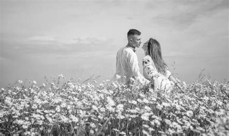 Couple In Love Of Man And Woman In Summer Daisy Flower Field Copy Space Wedding Stock Image