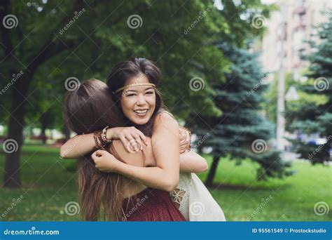 Two Happy Young Girls Hug Each Other In Summer Park Stock Image Image