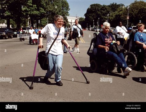 Woman With A Disability Walking With The Aid Of Crutches In Washington