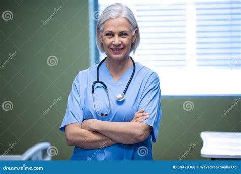 Portrait Of Nurse Standing With Arms Crossed Stock Photo Image Of