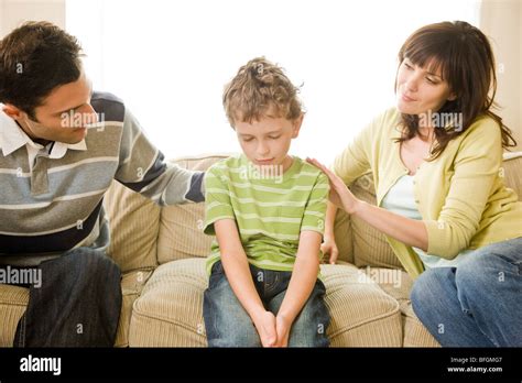 Parents Talking With Son Stock Photo Alamy