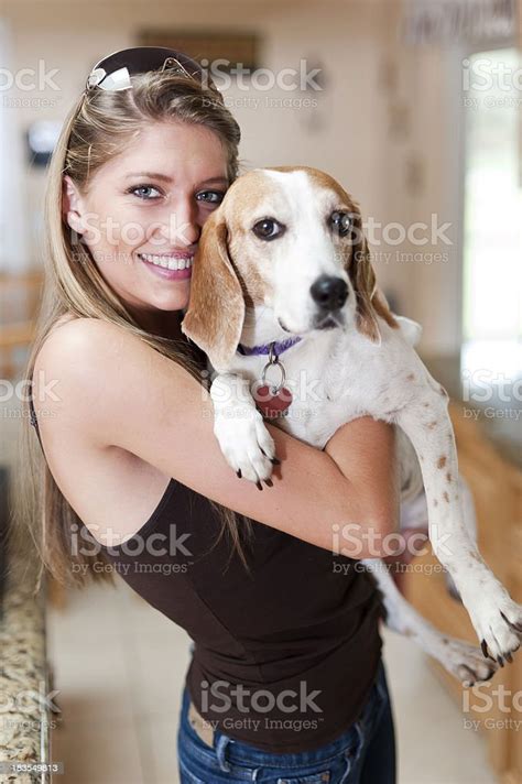 Beautiful Woman Holding Her Dog Stock Photo Download Image Now 20