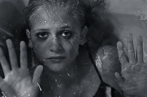 Portrays A Girl Who Has Been Trapped Behind Glass Representing A