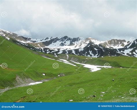 Breathtaking Landscapes With Green Grass Mountains And Snow In Swiss