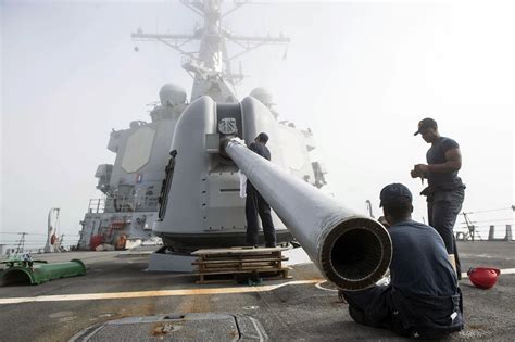 Sailors Perform Maintenance On The 5 Inch Gun Aboard Uss R Flickr
