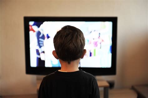 Child boy watching tv at home free image