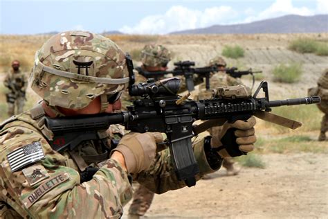 U S Army Sgt Douglas Ouellette Fires His M4 Carbine During Partnered Marksmanship Live Fire