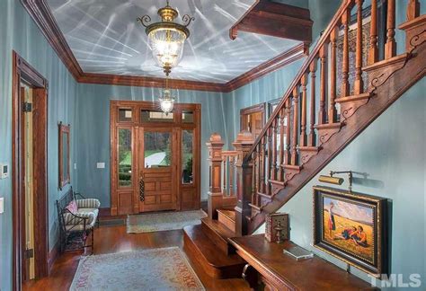 Gorgeous Foyer Entryway Of Old Victorian Home Featuring Warm And